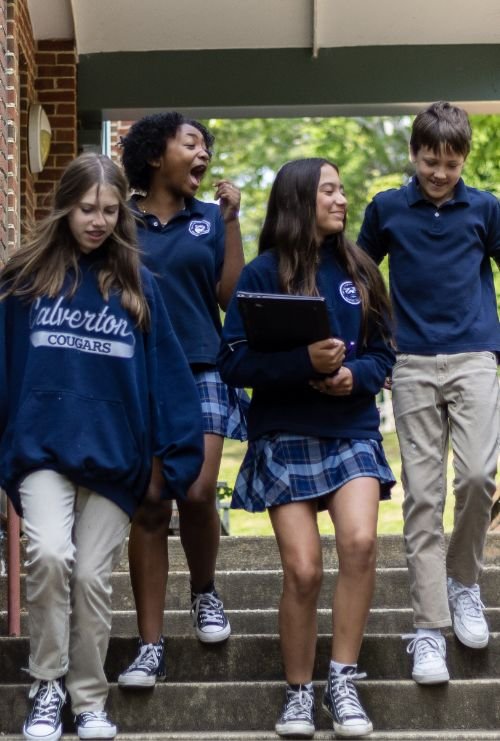 students walking down outdoor stairs