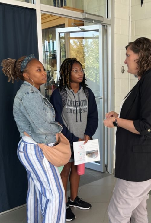 Calverton student and parent discussing college options with a school counselor