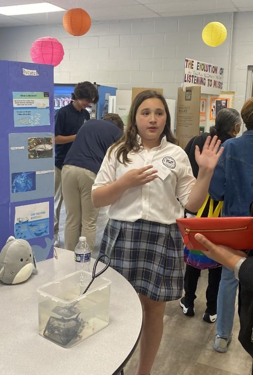 student presenting a science fair project