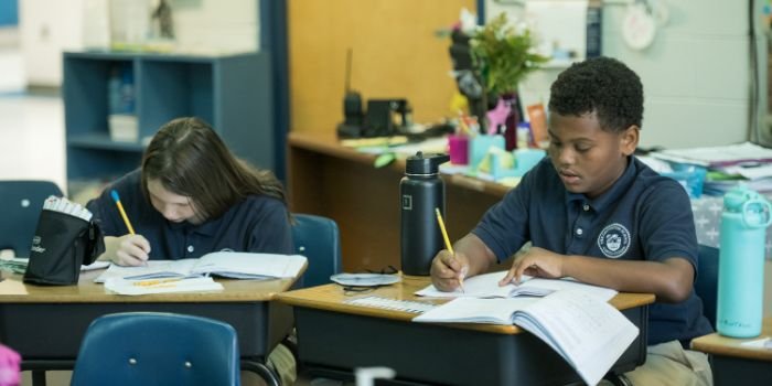 two students working in classroom